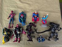 Group shot of all ten action figures on table