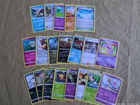 Full spread of roughly 22 Pokémon cards