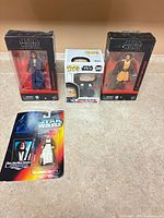 Group shot of all four unopened Star Wars figures