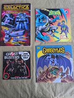 Group shot of all four franchise books