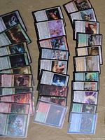 Overhead view of entire spread showing colour and rarity mix, some sleeved cards visible