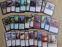 Full view of approx. 40 assorted Magic cards spread in three rows