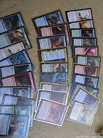 Full spread of sleeved MTG cards showing quantity and variety