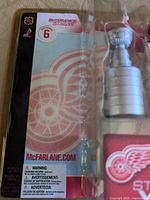 Front view of sealed package showing figure and Stanley Cup accessory