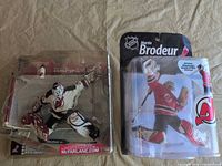 Full view of figure in damaged packaging and net accessory