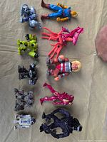 All 12 figures arranged on beige cloth