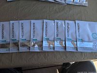 Seven of the NEOSTRATA face mask sachets laid out front side up