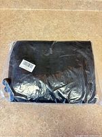 Sealed black mesh panels in original plastic