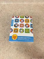 Front of sealed box showing Chupa Chups retro disc designs and piece count
