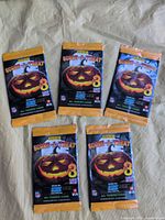 Front view of all five sealed packs