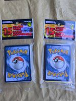 Both sealed 15-card Pokémon repacks front view