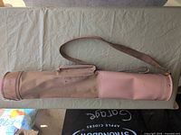 Full view of slim Spalding golf bag showing canvas body, vinyl section, strap and handle