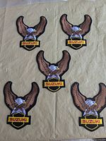 Front view of all five Suzuki eagle patches