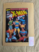 Front cover of The Uncanny X-Men Wizard ACE Edition comic on backing board