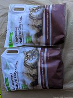Front view two sealed litter bags showing weight and features