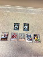All items overview: two sealed Panini packs and five rookie cards