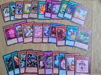 Overview spread of approximately 40 Yu-Gi-Oh! cards showing mix of Monster, Spell and Trap types