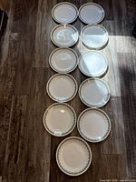 All eleven dinner plates laid out on floor