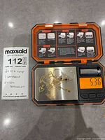 Lot on scale showing all five pieces and weight 5.36 g