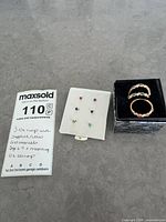 Overview of rings, earrings and handwritten info card