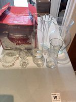 Group view of punch bowl box, four vases, ruffled dish, pair candle holders