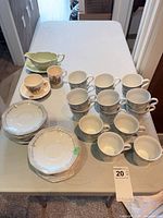 Full lot showing cups, saucers, gravy boat, misc mug
