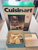 Boxed Cuisinart food processor with accessory box