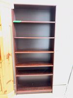 Front view showing six shelves and overall condition