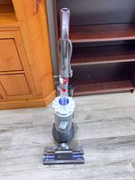Front view of Dyson Slim Ball vacuum standing upright