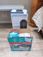 Both retail boxes: Bionaire air purifier and Honeywell HCM-750 humidifier