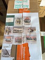 Shipping box showing printed reference images of Lilliput Lane models