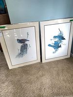Both framed prints side by side