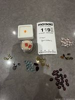 Overview of lot showing grouped coloured stones on countertop