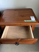 Nightstand top view with open top drawer