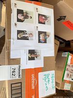 Shipping box with thumbnail images of each figurine taped on top