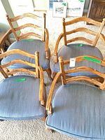 Top view of four ladderback armchairs showing frames and upholstery