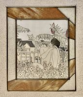 Front view of stained glass window and silk portrait