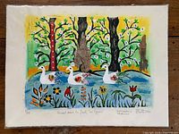 Full view of unframed print showing swans, forest, collage, beads