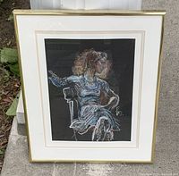 Full view of framed drawing showing seated woman artwork, matting and gold frame