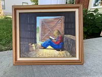 Full view of framed painting on exterior surface