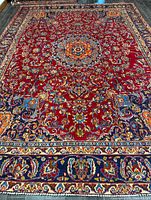Full view of rug showing entire field, medallion, and borders