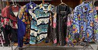 All five jackets hanging on rack
