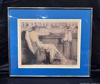 Full view of framed Louis Icart print with blue mat and metallic frame