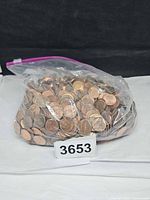 Full bag of pennies front view with lot number visible