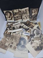 Spread of assorted sepia and grayscale postcards laid out