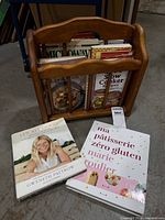 Magazine rack with cookbooks, two titles displayed in front