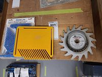Overview showing Delta feather boards package, yellow feather board, Craftsman dado blade