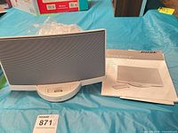 Front view of Bose SoundDock speaker dock with manual