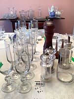 Group view showing flutes, mills, shakers, oil carafe and napkin holder
