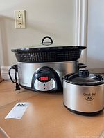 Smart-Pot slow cooker and Little Dipper side by side showing size comparison and exterior condition